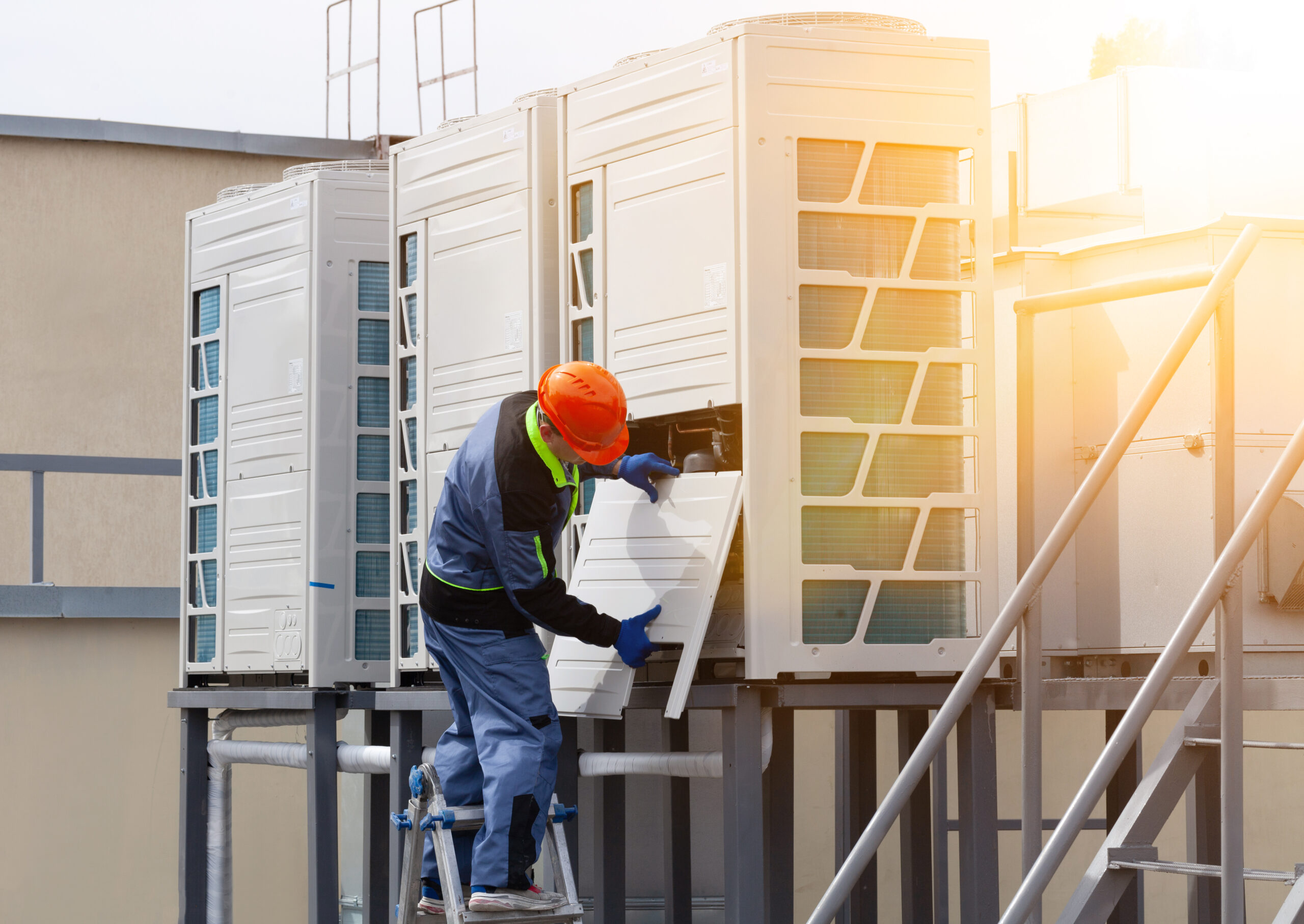 2019-105-28, Kyiv, Ukraine. two people repairing an industrial air conditioner